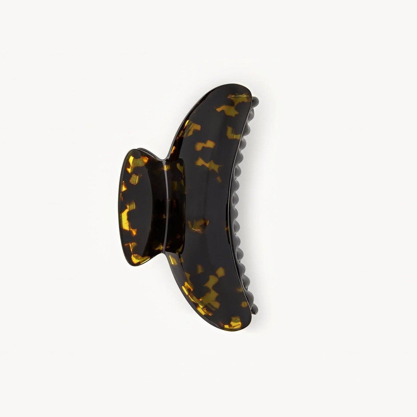 Tortoiseshell patterned hair clip on a white background