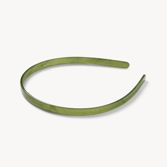 Green headband on a white background