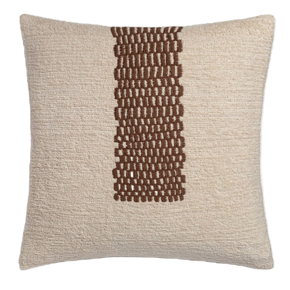 Textured pillow with a brown woven pattern on a light gray background