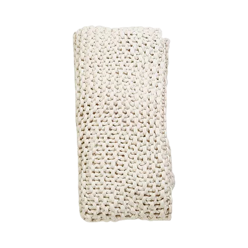 Finn Hand Knit Throw in chunky yarn with soft texture and neutral tones, perfect for layering on sofas, chairs, or beds for cozy, artisanal style.