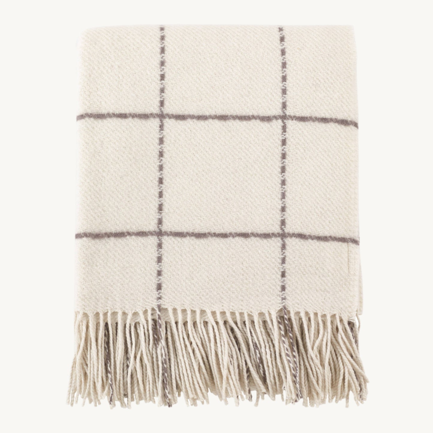 Geometric Design Throw with bold black-and-white pattern and soft woven texture, perfect for layering on sofas or beds for a modern, stylish touch.
