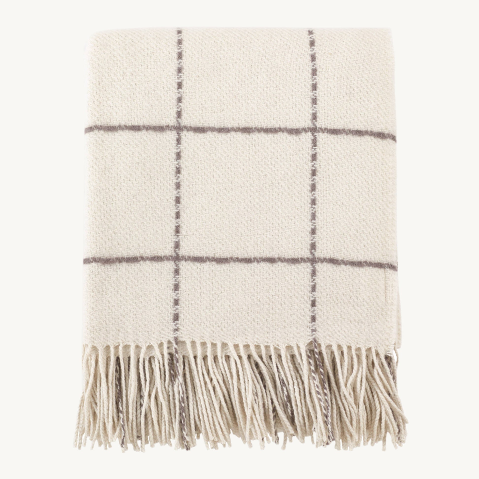 Geometric Design Throw with bold black-and-white pattern and soft woven texture, perfect for layering on sofas or beds for a modern, stylish touch.