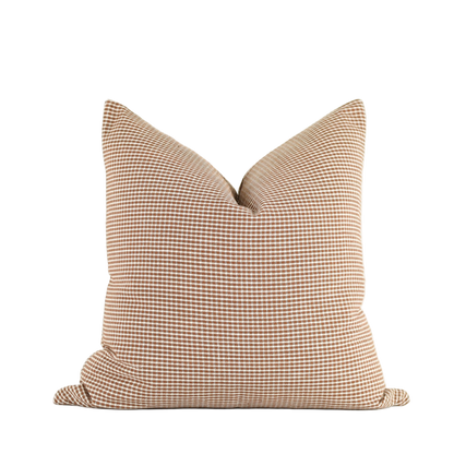 Georgie Rust Pillow 22x22 with warm rust-colored fabric and soft checked pattern, perfect for adding cozy, stylish accent to sofas or beds.