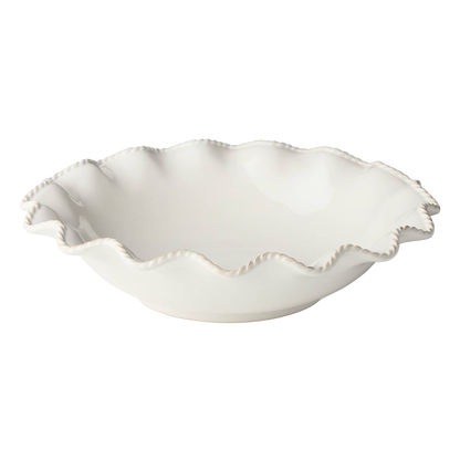 White ceramic bowl with scalloped edge and unique detail for serving or hosting