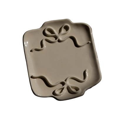 Stephanie Dawn Matthias decorative ceramic plate with two ribbon decals on the sides