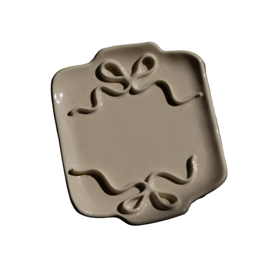Stephanie Dawn Matthias decorative ceramic plate with two ribbon decals on the sides