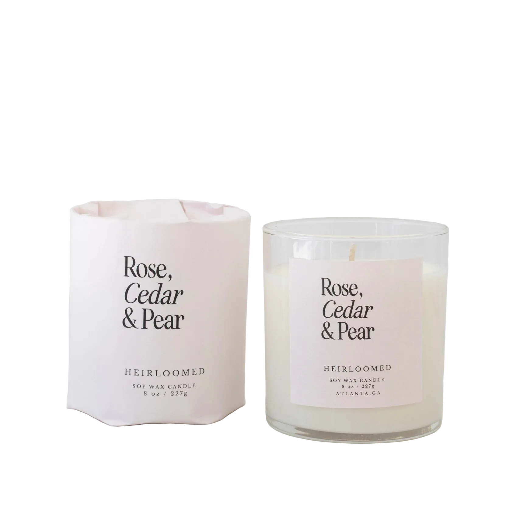 Rose, cedar, and pear scented candle by Heirloomed Candles with layered floral and woody fragrance