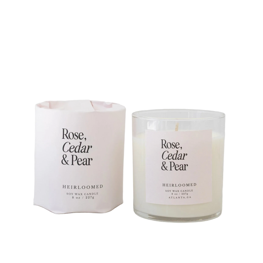 Rose, cedar, and pear scented candle by Heirloomed Candles with layered floral and woody fragrance