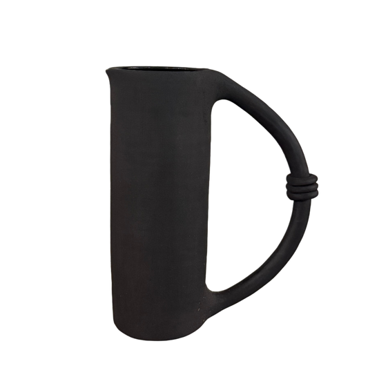 Black matte ceramic pitcher with a uniquely designed handle 