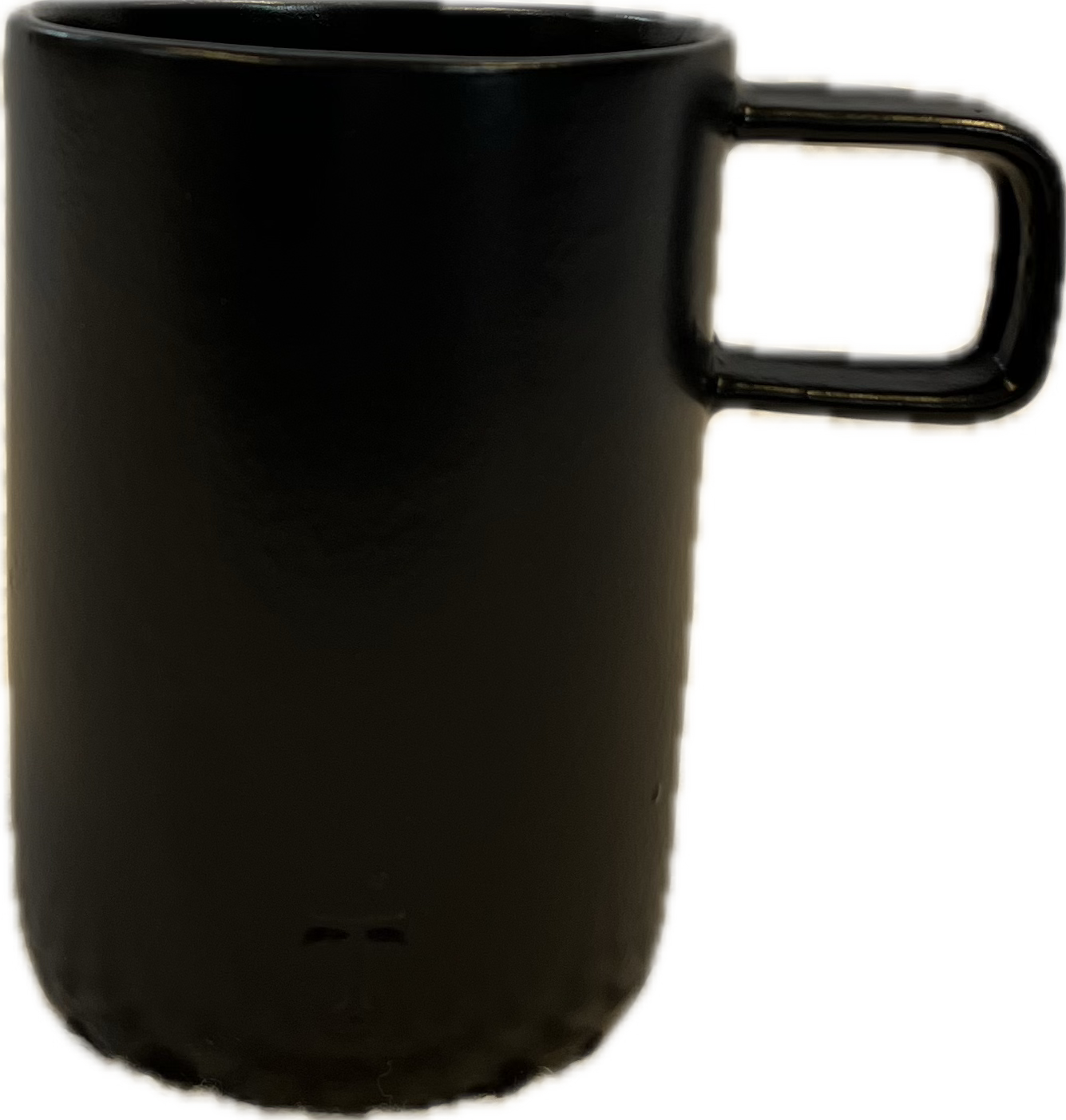 A unique black ceramic coffee mug with a handle, sourced in Mexico City