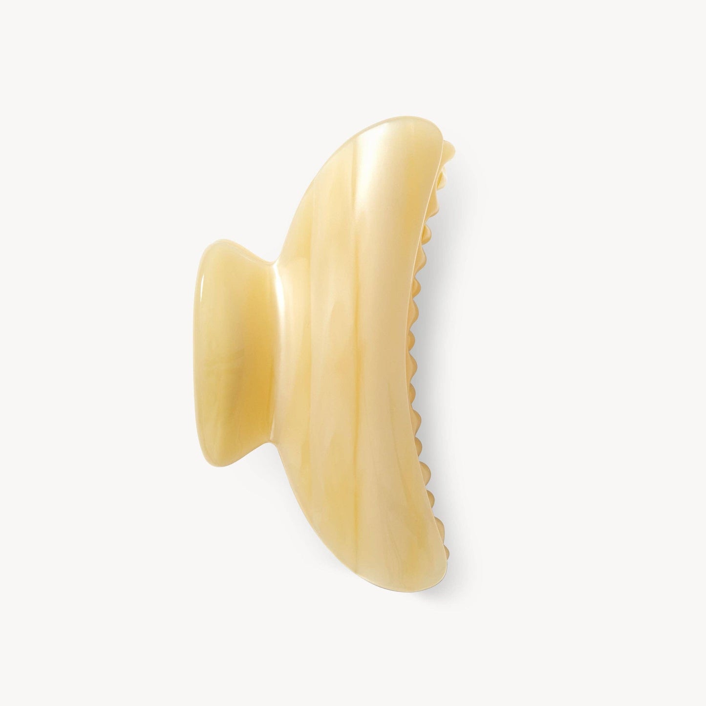 Beige hair clip on a white background