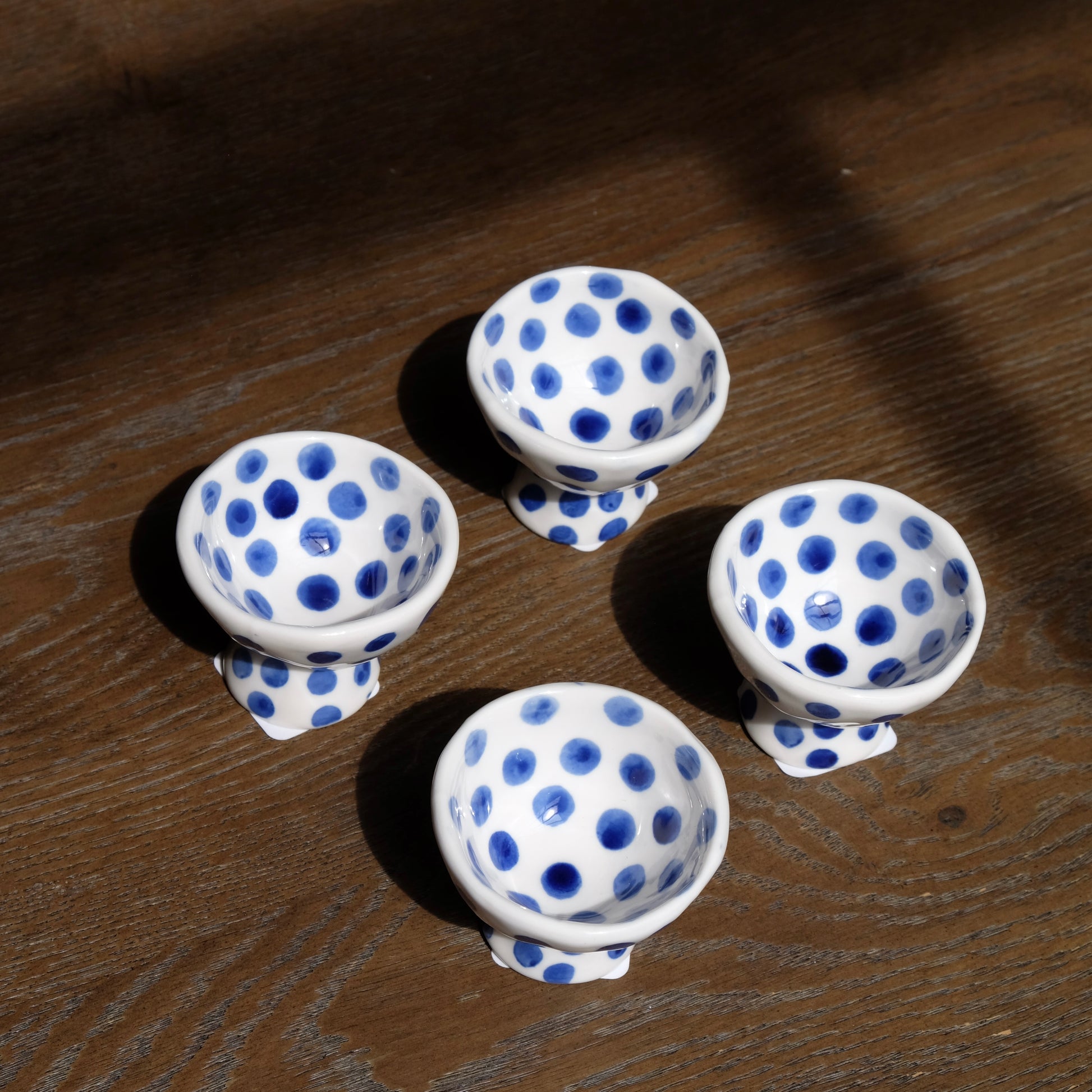group of blue polka dot ceramic egg cups 