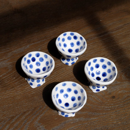 group of blue polka dot ceramic egg cups 
