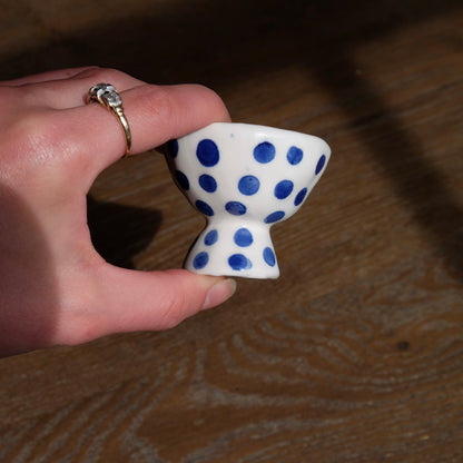 side view of blue polka dot ceramic egg cup