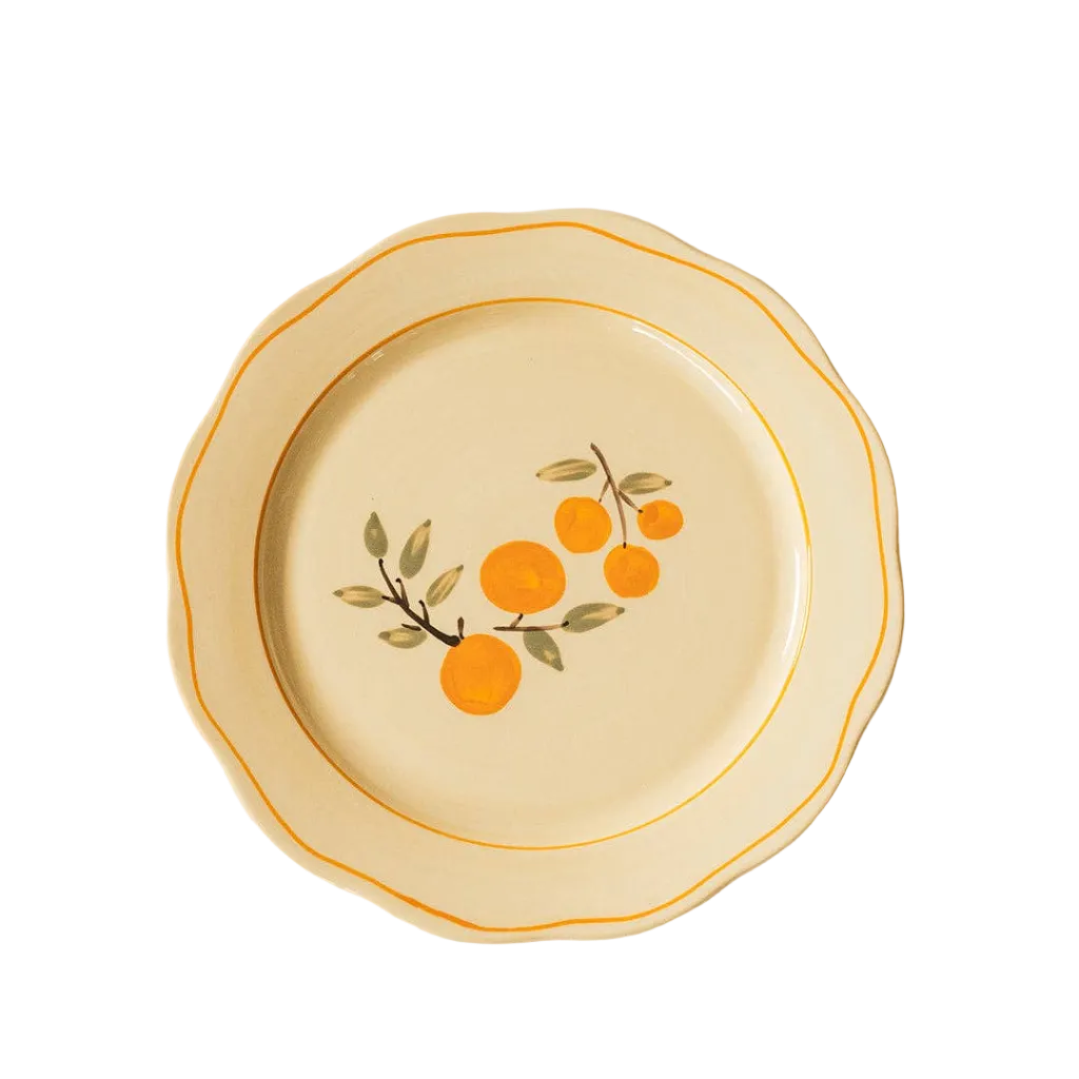 ivory ceramic dinner plate with citrus and orange trime detail 