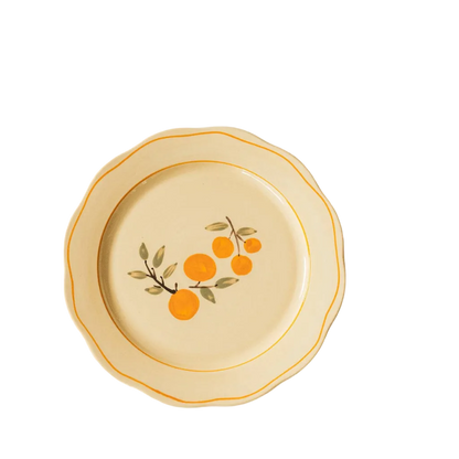 ivory ceramic dinner plate with citrus and orange trim detail