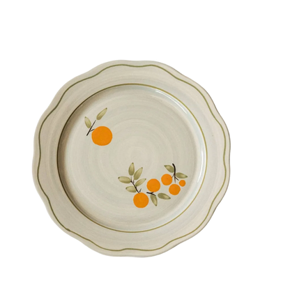 blue gray ceramic plate with citrus and green trim detail
