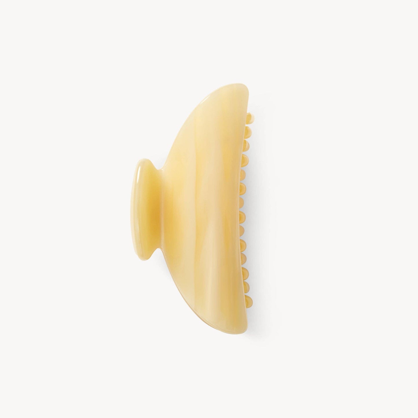 Yellow hair clip on a white background