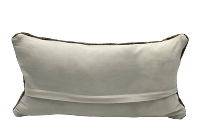 rear view of vintage turkish lumbar pillow with white cotton backing and hidden zipper closure